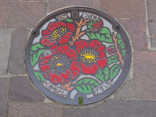 Manhole drain cover on the street at Kumamoto, Japan