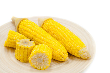 Sweet boiled corn on wood bowl on white background