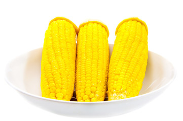 Three Sweet boiled corn on white background