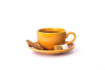 Orange mug with cinnamon and sugar
