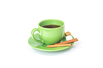 Obraz premium Green mug with cinnamon and sugar