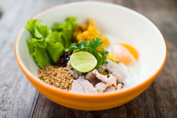 Pork noodle with Soft-boiled egg on wooden table