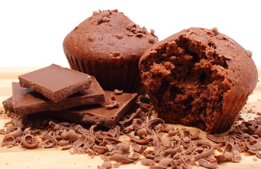 Fresh baked muffins, grated and portion of chocolate