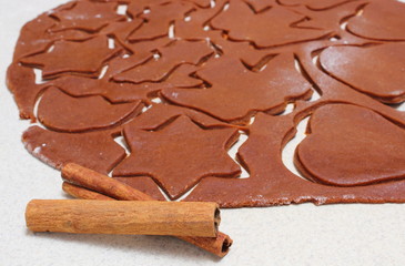 Gingerbread dough for Christmas cookies and cinnamon sticks