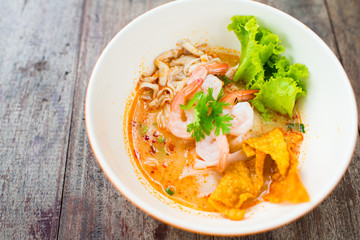 prawn mee or prawn noodles on wooden background