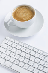 Cup of coffee with a keyboard