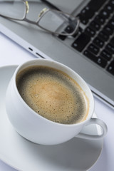 Cup of coffee with a keyboard
