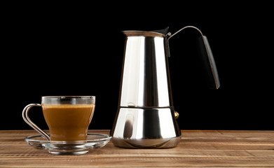 Cup of coffee and a coffee pot