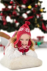 Festive little girl in hat and scarf