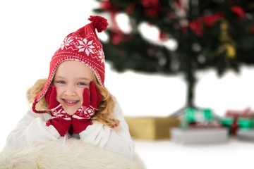 Festive little girl in hat and scarf