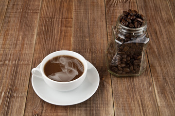 cup of coffee and grain in a jar