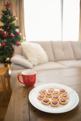 Cookies and mug on coffee table at christmas