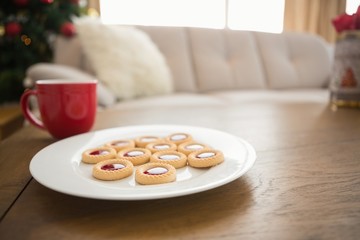 Cookies and mug on coffee table at christmas