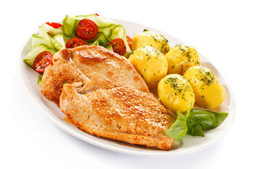 Fried pork chops, boiled potatoes and vegetable salad