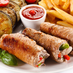 Wrapped pork chop, boiled potatoes and vegetables