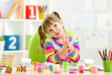 child girl drawing and making by hands