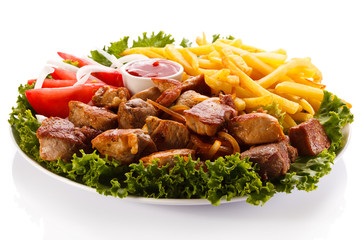 Fried chicken nuggets, French fries and vegetables