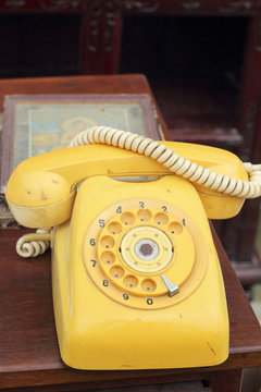 old phone vintage style on the wooden floor.