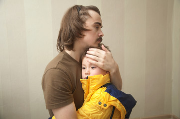 Father and son hugging