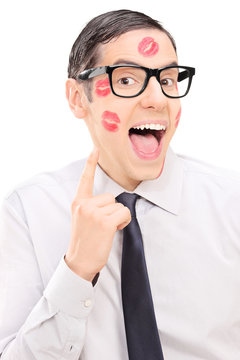 Guy showing the lipstick kiss marks on his face