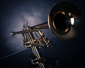 Trumpet in front of blue wrinkled background
