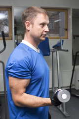 adult engaged in active sports in the gym