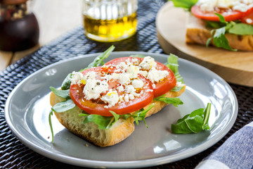 Feta with tomato and rocket sandwich