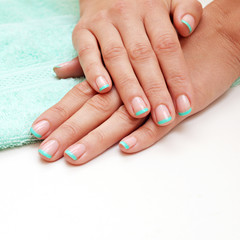 Female soft hands with beautiful french manicure