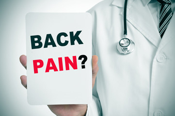 doctor with a signboard with the question back pain?