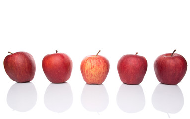 A group of red apples over white background
