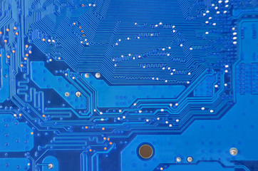 Close up of a printed blue computer circuit board
