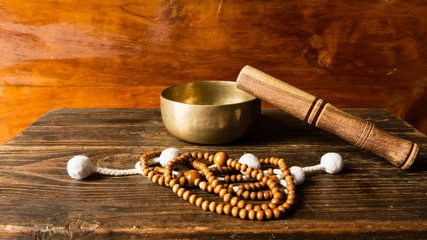 Preparing to meditation and prayer with tibetan bell and buddhis