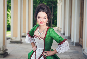 Beautiful woman in green medieval dress