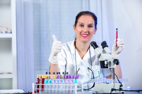 Eureka!!! Young Scientist Woman Working At The Laboratory