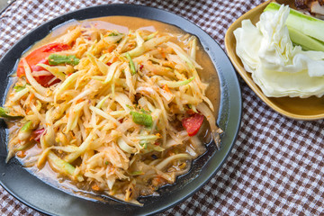 Closeup Thai papaya salad serve with vegetables, popular thai