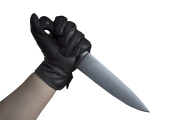 Hand in leather gloves holding knife