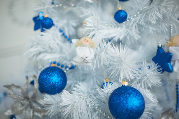 Fototapeta na wymiar Christmas toys in the form of balls, stars, beads, garlands hang
