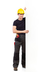 Construction worker holding a big white banner