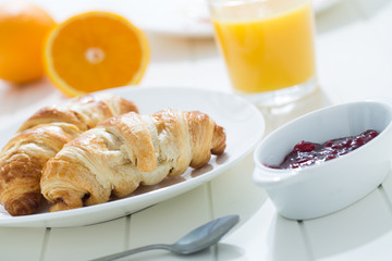 delicious breakfast with croissants and juice