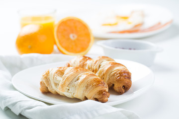 delicious breakfast with croissants and juice
