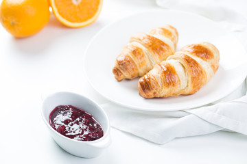 delicious breakfast with croissants and juice