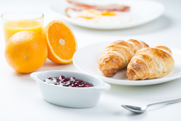 delicious breakfast with croissants and juice