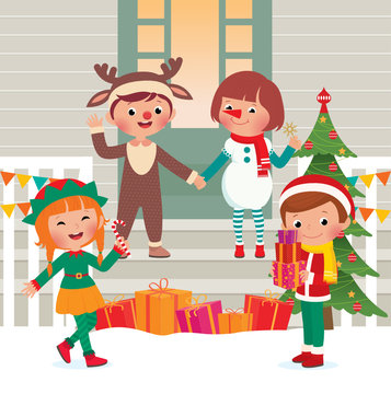 Children on the doorstep in Christmas Costumes