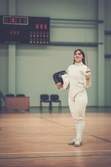 Young woman fencer with epee