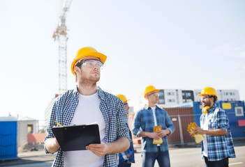 group of builders in hardhats outdoors
