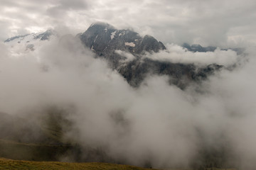 mountain range in Dolomites obscured by clouds