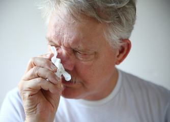Senior man with runny nose