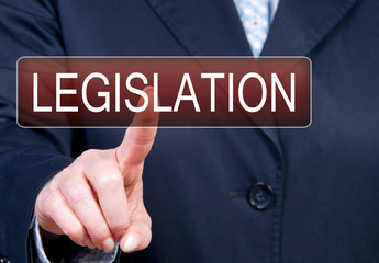 Legislation - female hand with touchscreen