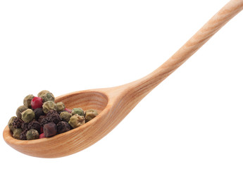 Pepper seasoning  mix in wooden spoon isolated on white backgrou