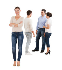 Fototapeta premium Confident Businesswoman Standing With Team Over White Background
